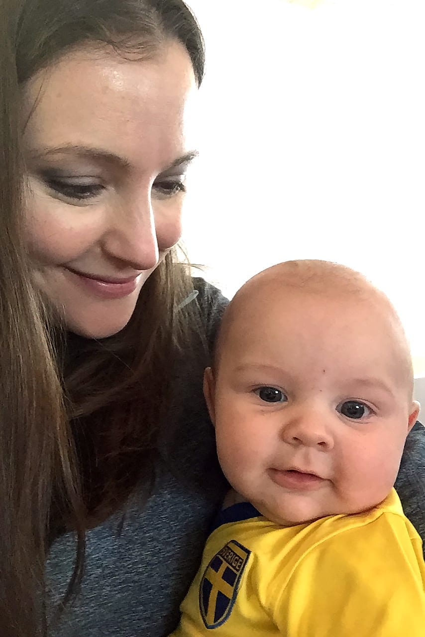 A photo of Sunday Riley and her son.