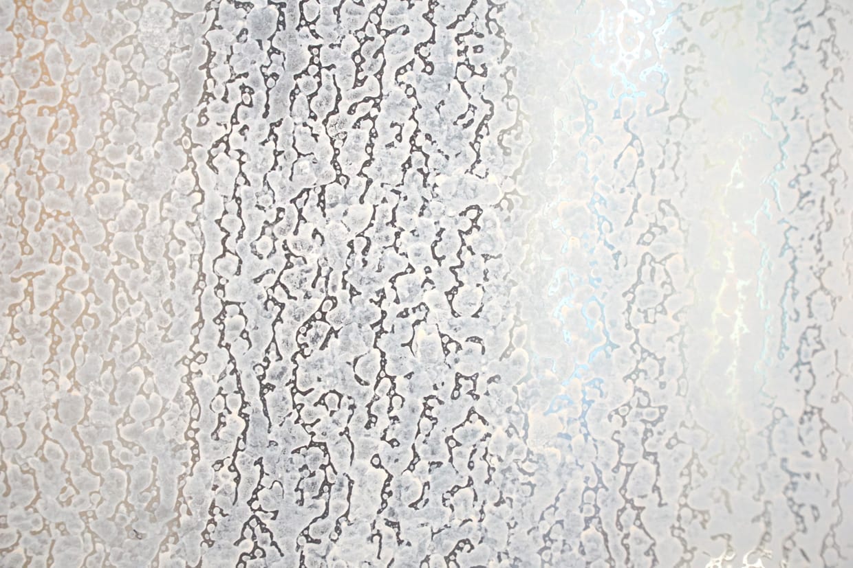 Dry hard water stains on glass in the bathroom.
