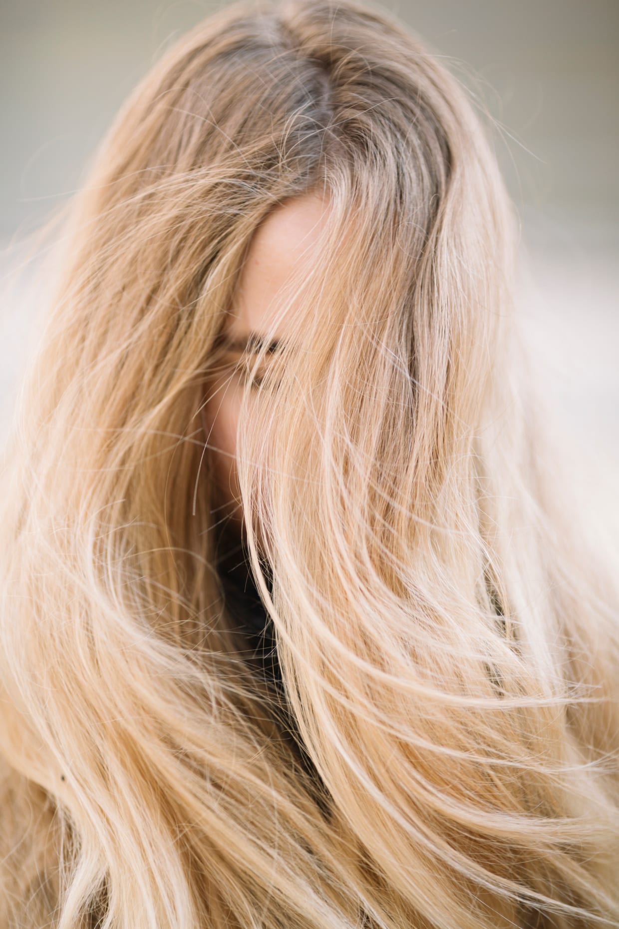 A woman with frizzy blonde hair.